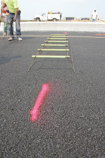 With little or no fine material, the 'popcorn' mix for the open drainage layer allows water to flow away from the concrete pavement.