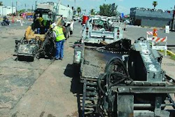 A Caterpillar skid steer paired with a set of attachments, a trailer and a truck allowed the operator to efficiently travel around the jobsite and prepare the trench for the guide wires with minimal labor required.