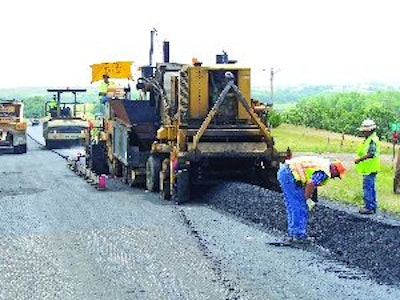The project consisted of 6,000 tons of conventional hot mix and 5,570 tons of warm mix. The temperature of the mix was monitored to determine the rolling pattern required to achieve density for both hot and warm mixes.