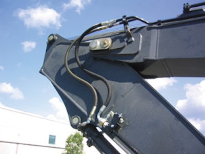 Always be careful about hose line routing. Note how the stick hoses on this HKX auxiliary kit follow factory lines to reduce wear.