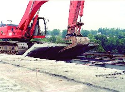 Sometimes there is no economical alternative to a specialty tool such as this concrete slab removal bucket.