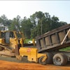 With the base-spreader attachment, Prince Contracting has increased daily road spread to 3,400 tons of base material and 3,200 linear feet of graded and compacted base.