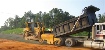 With the base-spreader attachment, Prince Contracting has increased daily road spread to 3,400 tons of base material and 3,200 linear feet of graded and compacted base.