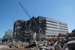 Rachel Contracting used crane and wrecking ball to bring down the massive Building 42 and prevent damage to the historic 3M headquarters behind it.
