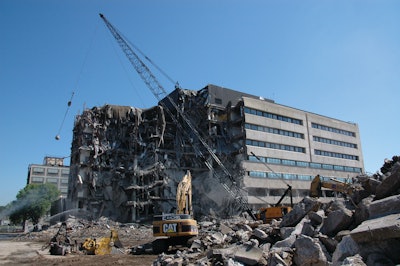 Rachel Contracting used crane and wrecking ball to bring down the massive Building 42 and prevent damage to the historic 3M headquarters behind it.