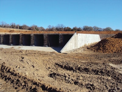 The 2,566 linear feet of precast concrete consisted of two separate culverts; a single barrel culvert with 256 linear feet of 10-ft. by 9-ft. reinforced concrete box and a 21 barrel culvert with a final length of 110 linear feet of 10-ft. by 9-ft. reinforced concrete box culvert per barrel.