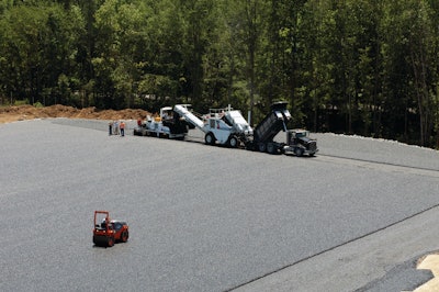 The asphalt was applied in two 4-inch lifts of AS binder containing 10% RAP. The layers were capped with 1.25 inches of Open Graded Friction Course (OGFC) surrounded by riprap.