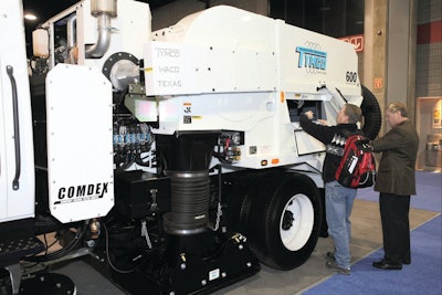 A contractor inspects a Tymco sweeper at NPE 2011 that was held in Nashville.