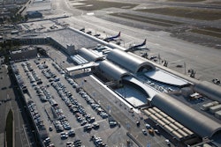 An aerial view of the new 280,000-square-foot John Wayne Airport Terminal C with six bridged aircraft gates, two of which connect to Federal Inspection Services (FIS) (Customs) facilities for international flights and two new commuter terminals.