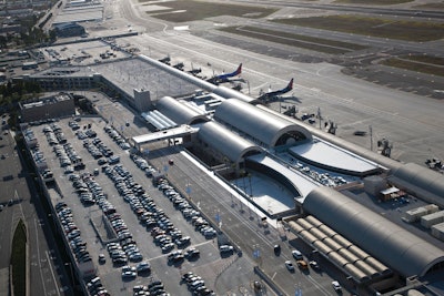 An aerial view of the new 280,000-square-foot John Wayne Airport Terminal C with six bridged aircraft gates, two of which connect to Federal Inspection Services (FIS) (Customs) facilities for international flights and two new commuter terminals.