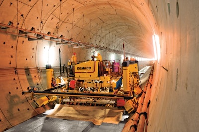 The Commander III's tracks were turned at 35-degree angles to pave inside the circular tunnel. The floor's profile was slipformed with a 28.3-in.-wide drainage channel.