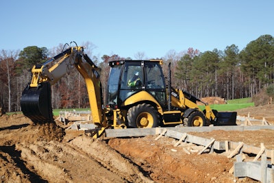 Cat added electronic throttle control and now has auto-idle on a backhoe loader. Stop using the controls for a preset time (typically 5 to 10 seconds) and the system automatically drops engine speed to low idle.