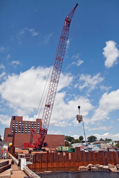For the pile driving, the crane worked with 247 feet of main boom, a wind tip attachment and a vibratory-hammer to drive the piles.