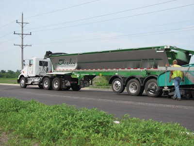 Overhead structures, such as power lines, are no longer an issue when contractors use live-bottom trailers.