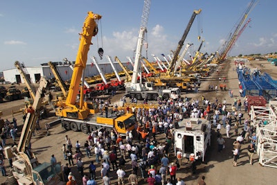 A large crowd gathers around a 2008 Liebherr LTM1160-51 160-ton all terrain crane at Ritchie Bros. Orlando auction in February 2011.