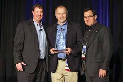 Dale Asplund (left), Senior Vice President Supply Chain, Business Services and Information Technology for United Rentals presents the Supplier of the Year Award for 2011 to Johannes Schulze Vohren, Vice President of Sales and Product Support and Steve Guditus, Strategic Accounts Manager of Wacker Neuson Corporation.