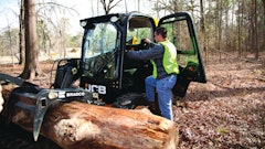 The single boom raising the bucket on JCB's skid steers allows a side-entry door that saves the operator the challenge of climbing over the work tool to enter and exit the machine.