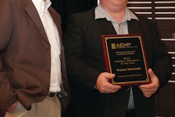 Tom Swisshelm (right), a 12-year veteran of Ohio-based Kokosing Construction, was nominated by his supervisor Carl Uhinck (left) and named AEMP Technician of the Year from private industry.