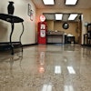 Royale Concrete rescued a 65-year-old concrete floor at a farm chemical warehouse by exposing aggregate and polishing to an 800-grit finish.