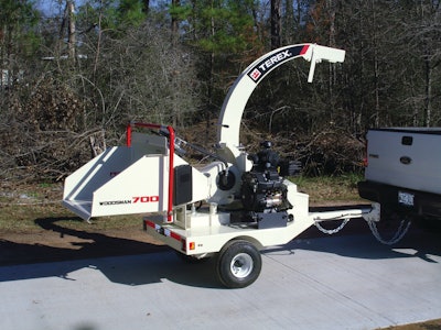 The Terex Woodsman 700 brush chipper is a 6-in. capacity towable unit with hydraulic feed roll and 24-in. diameter disc with two single-sided knives.