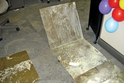 Water vapor that traveled through the concrete slab reached dew point and re-emulsified the water-based glue that once secured these carpet tiles to the concrete substrate.