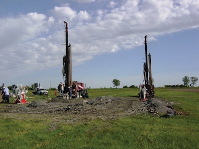 Drilling rigs, like these used for the closed-loop system installed at Lake Land College in Illinois, drill loop fields typically 100 to 300 feet deep.