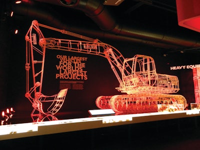 The centerpiece of the exhibition is a giant skeletal model of a JCB JS200 tracked excavator built to scale out of 8mm steel rod and created by artist Benedict Radcliffe.