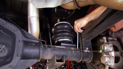 The Ride-Rite kit, which mounts between the truck's frame and suspension, uses air pressure to maximize the truck's safe load carrying capacity.