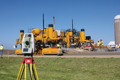 As part of the stringless paving process, Manatts used total stations to track the GOMACO GHP-2800 paver.