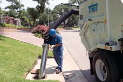 Tymco's hydraulic boom-assist hand hose enables the operator to clean catch basins and hard-to-reach areas.
