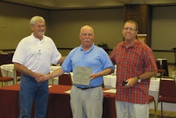 Scott Smith, left, and Barry Herbert, right, present CFA Executive Director Ed Sauter, middle, with the 2012 Robert D. Sawyer Distinguished Service Award at the CFA Summer Convention in Grand Traverse, Mich.