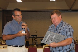 Jim Baty, left, presents Lance Jordan, right, with the CFA Contractor of the Year award.
