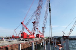 Four Manitowoc crawler cranes are working on an expansion project at Logan International Airport in Boston to lengthen the airport's longest west-to-east runway by building a 600- by 300-ft. pier out into Boston Harbor.