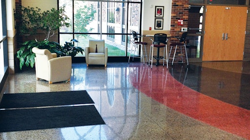 The architect for St. Philip High School wanted a flooring system that incorporated school colors and decorative saw cuts. Polished concrete was able to achieve that look at less than half the cost of terrazzo.