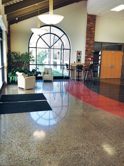 The architect for St. Philip High School wanted a flooring system that incorporated school colors and decorative saw cuts. Polished concrete was able to achieve that look at less than half the cost of terrazzo.