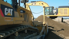 K&E Excavating’s D7E uses half the fuel of the company’s previous model. The company owns 115 pieces of Cat equipment, including the D7E and a 349E (shown working in the background).
