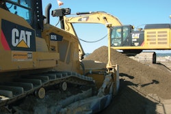 K&E Excavating’s D7E uses half the fuel of the company’s previous model. The company owns 115 pieces of Cat equipment, including the D7E and a 349E (shown working in the background).