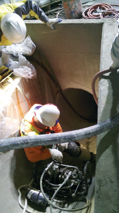 To repair a concrete culvert on a mountainside, the contractor sent an apparatus down the pipe on a sled to the exit of the pipe where the material was then sent through the hose and shot out at 360 degrees to cover the entire pipe.