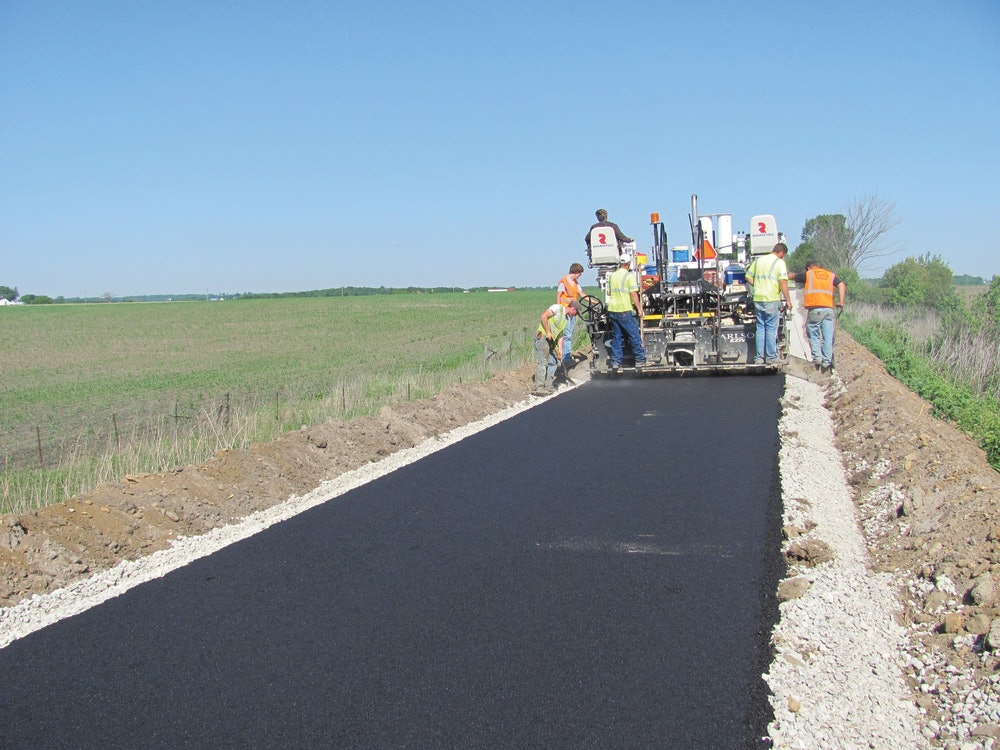 Paving an asphalt bike trail | For Construction Pros