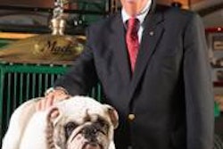 Kevin Flaherty, president, Mack Trucks North American Sales & Marketing, with Mack the Bulldog and the iconic Bulldog hood ornament in the background.
