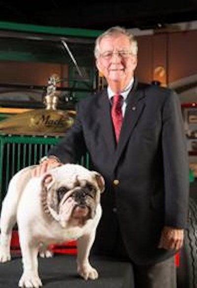 Kevin Flaherty, president, Mack Trucks North American Sales & Marketing, with Mack the Bulldog and the iconic Bulldog hood ornament in the background.