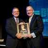 Sam Allen, Chairman and Chief Executive Officer, Deere & Company, accepts the AEM Hall of Fame plaque from Rusty Fowler, 2012 Chair of the AEM and CEO of Krone, North America