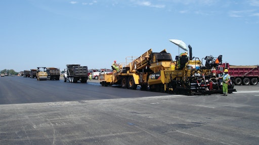 To help assure non-stop paving, the crew waited until at least three trucks were in front of the paver before starting each pull.