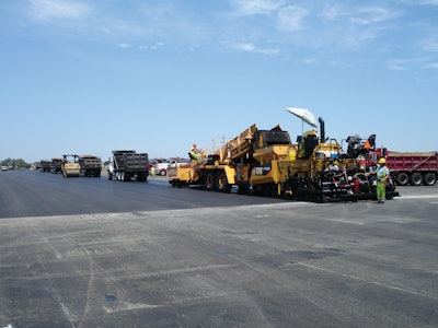 To help assure non-stop paving, the crew waited until at least three trucks were in front of the paver before starting each pull.