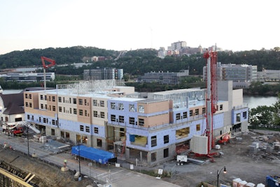A Potain Igo 50 and a HDT 80 lifted 653 structural metal stud and interior load bearing panels to construct the newseven-story Hyatt hotel in Pittsburgh.