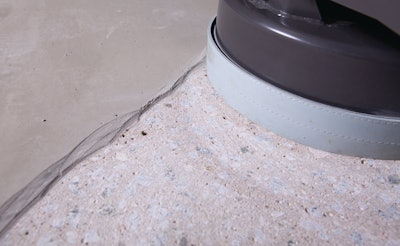 Contractors can remove a thick residue from a concrete surface with the right grinder and diamond combination.