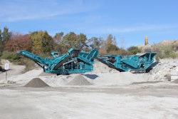 Powerscreen XH500 impact crusher feeding a Warrior 1400X screen in recycled concrete and asphalt application.