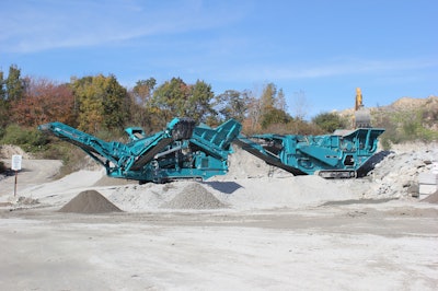 Powerscreen XH500 impact crusher feeding a Warrior 1400X screen in recycled concrete and asphalt application.