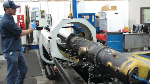 Cat dealer's hydraulic shop salvages cylinders with tube hone.