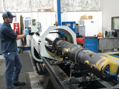 Cat dealer's hydraulic shop salvages cylinders with tube hone.